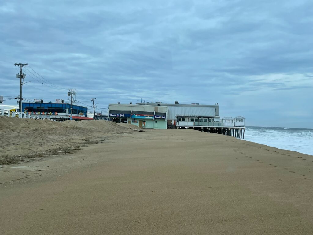 a sandy beach with buildings along it (MyCoast AI)