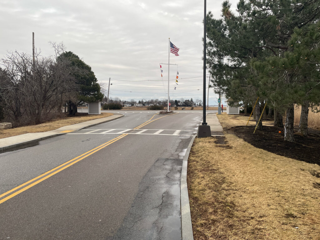 a road with flags on the side (MyCoast AI)