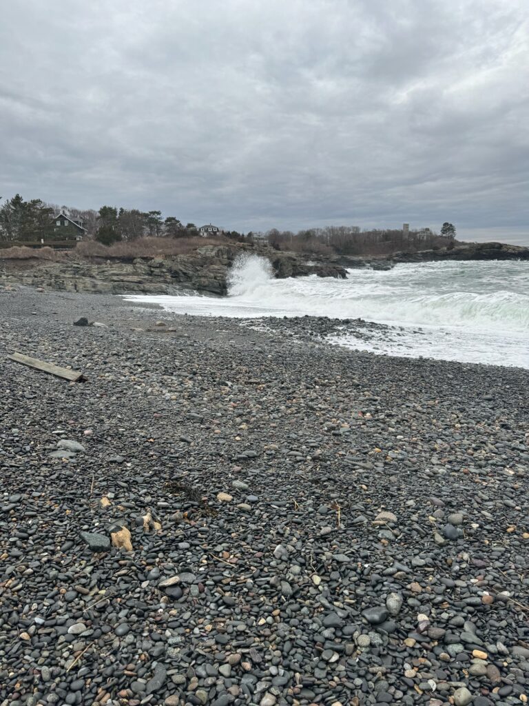 a rocky beach with waves crashing (MyCoast AI)