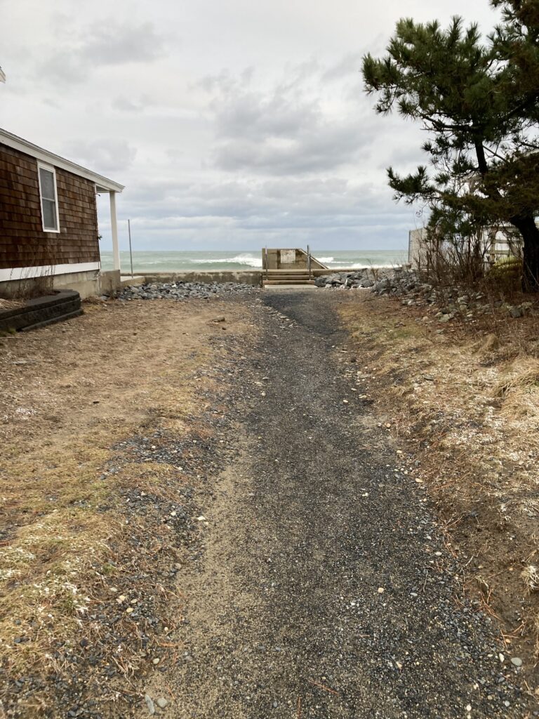 a dirt road next to a building (MyCoast AI)
