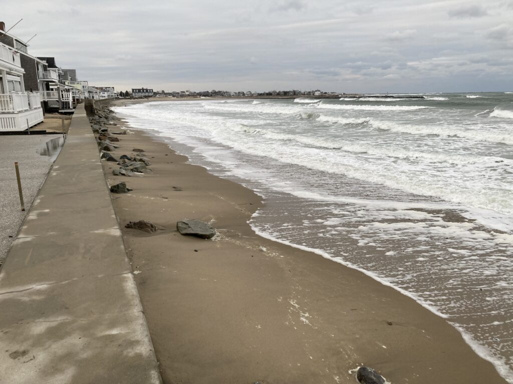 a beach with waves crashing on it (MyCoast AI)