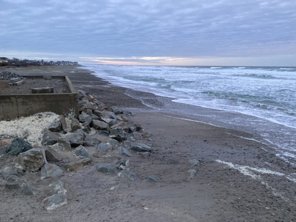 a rocky beach with a body of water in the background (MyCoast AI)