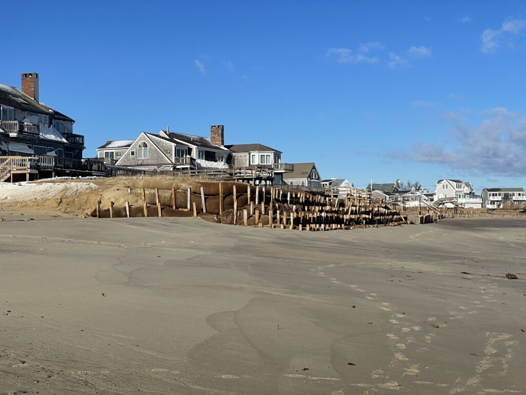 a beach with houses and a fence (MyCoast AI)
