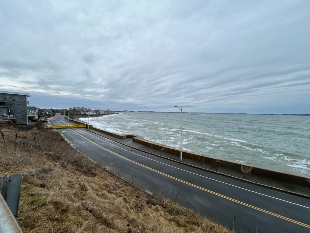 a road next to a body of water (MyCoast AI)