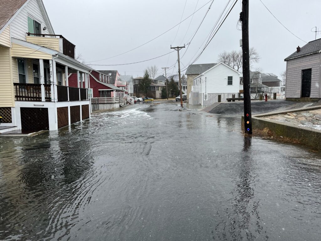 a flooded street with houses (MyCoast AI)