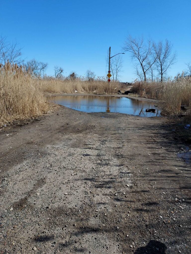 a small pond in a dry area (MyCoast AI)