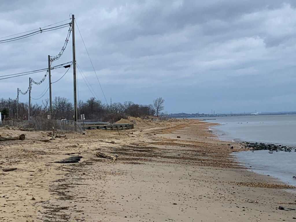 a beach with a bench and a pier (MyCoast AI)
