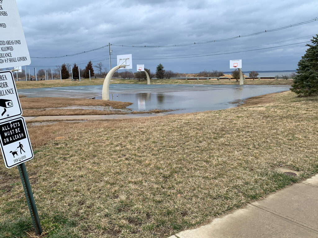 a flooded area with a sign (MyCoast AI)