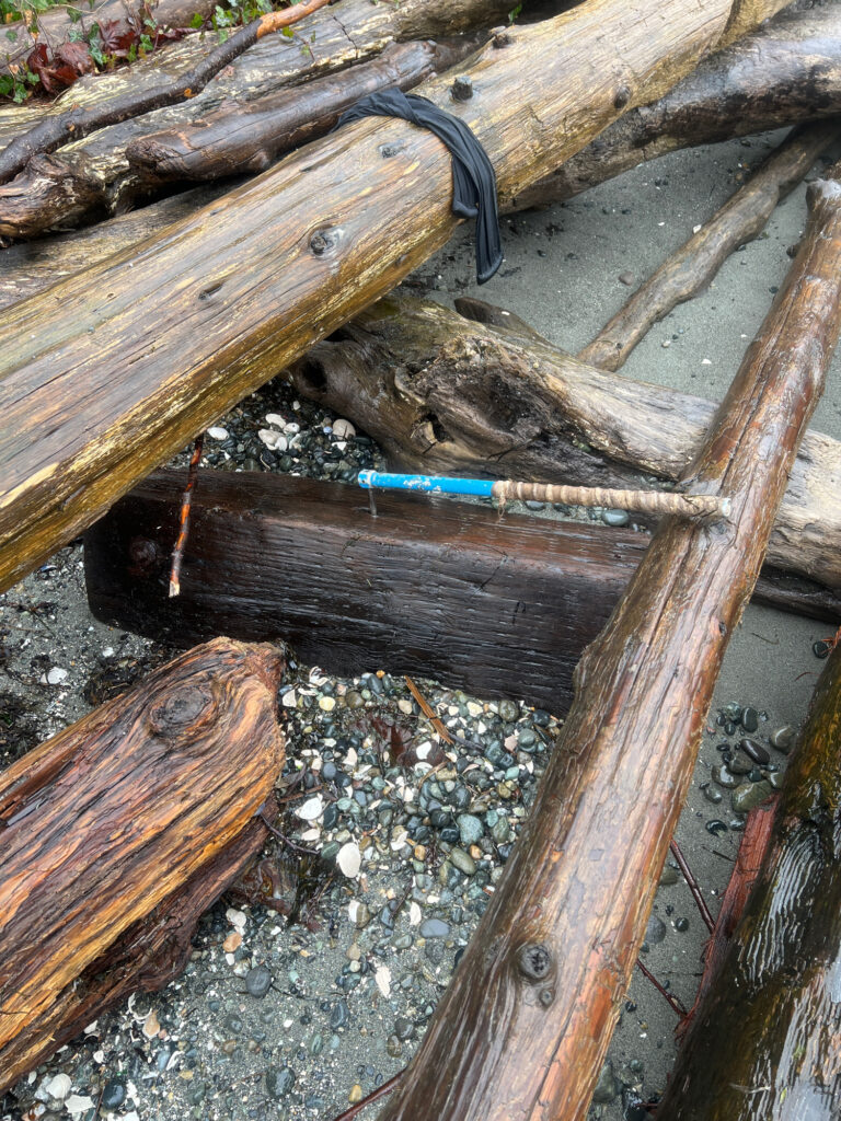a wooden bench with a blue handle (MyCoast AI)