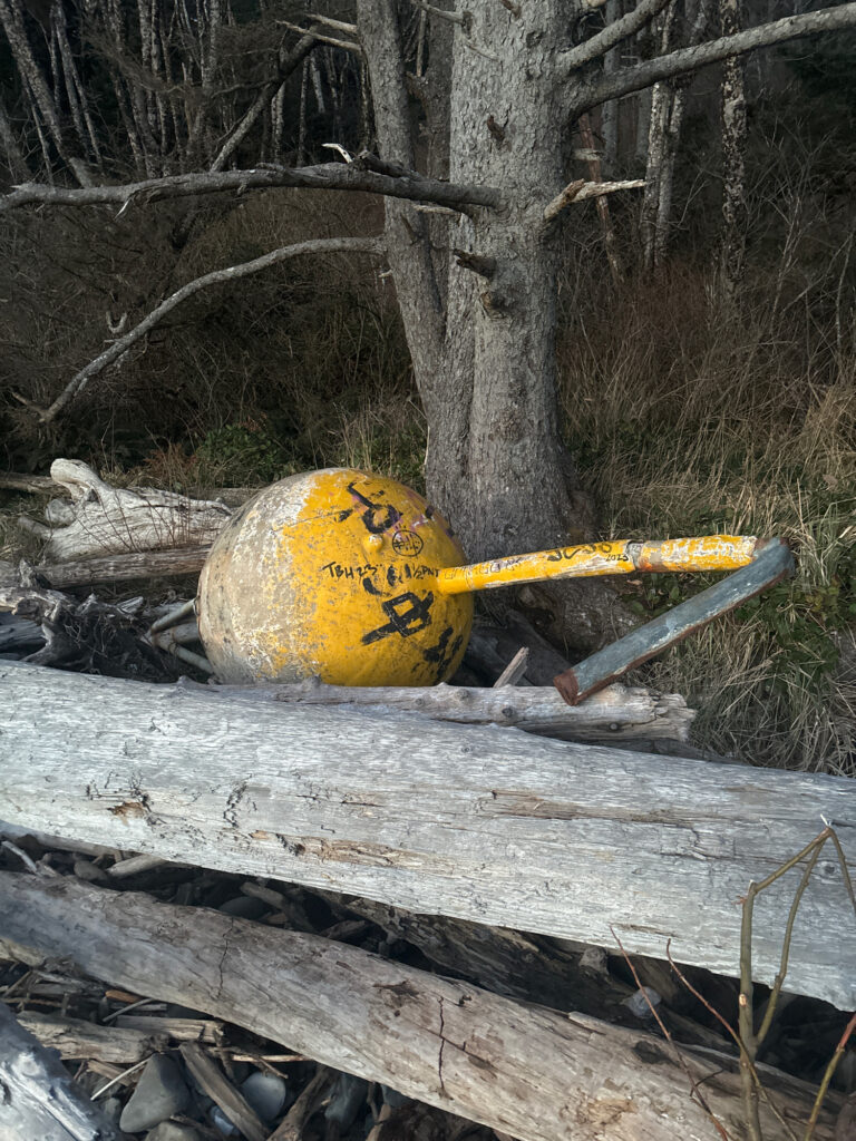 a yellow shovel on a log (MyCoast AI)