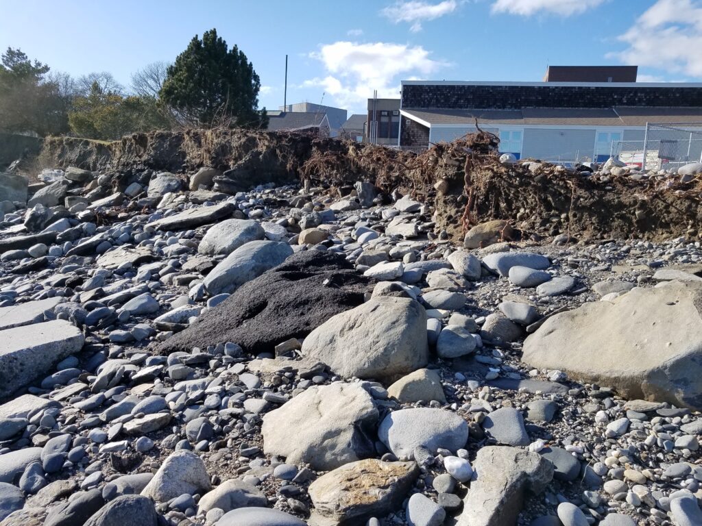 a rocky area with a building in the background (MyCoast AI)