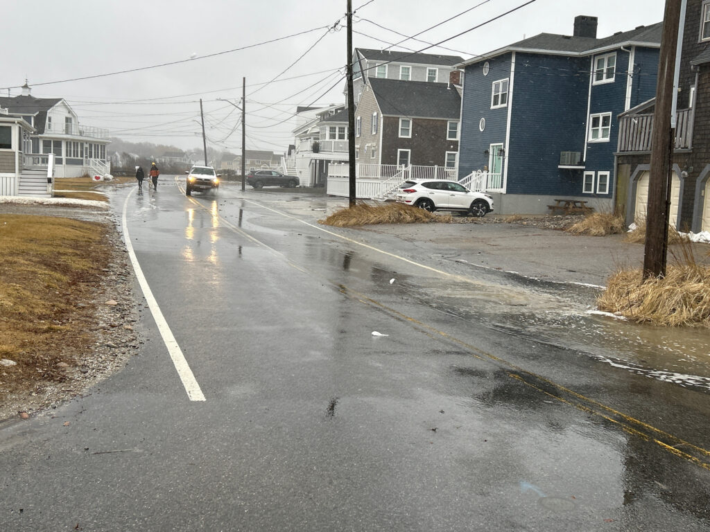 a street with cars and houses along it (MyCoast AI)