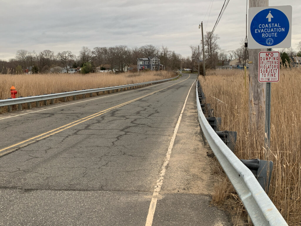 a road with a sign on it (MyCoast AI)