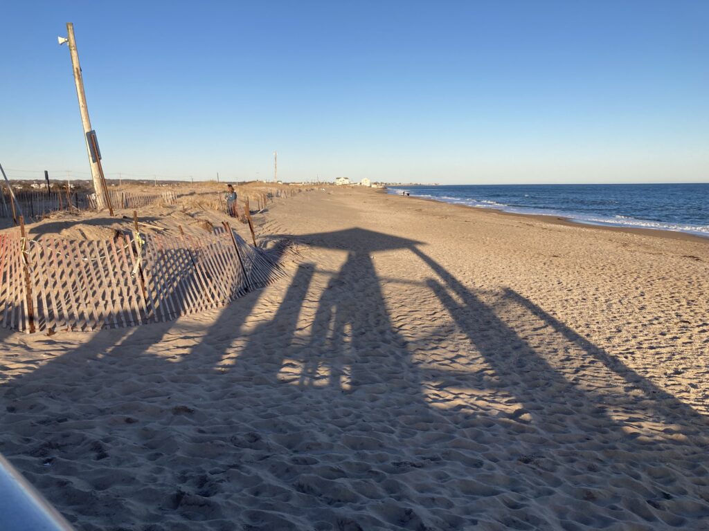 a sandy beach with a fence (MyCoast AI)