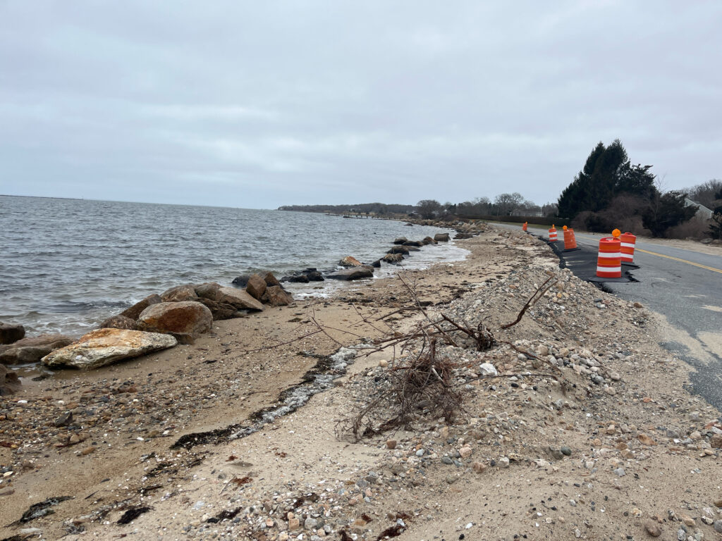 a rocky beach with a road and a body of water (MyCoast AI)