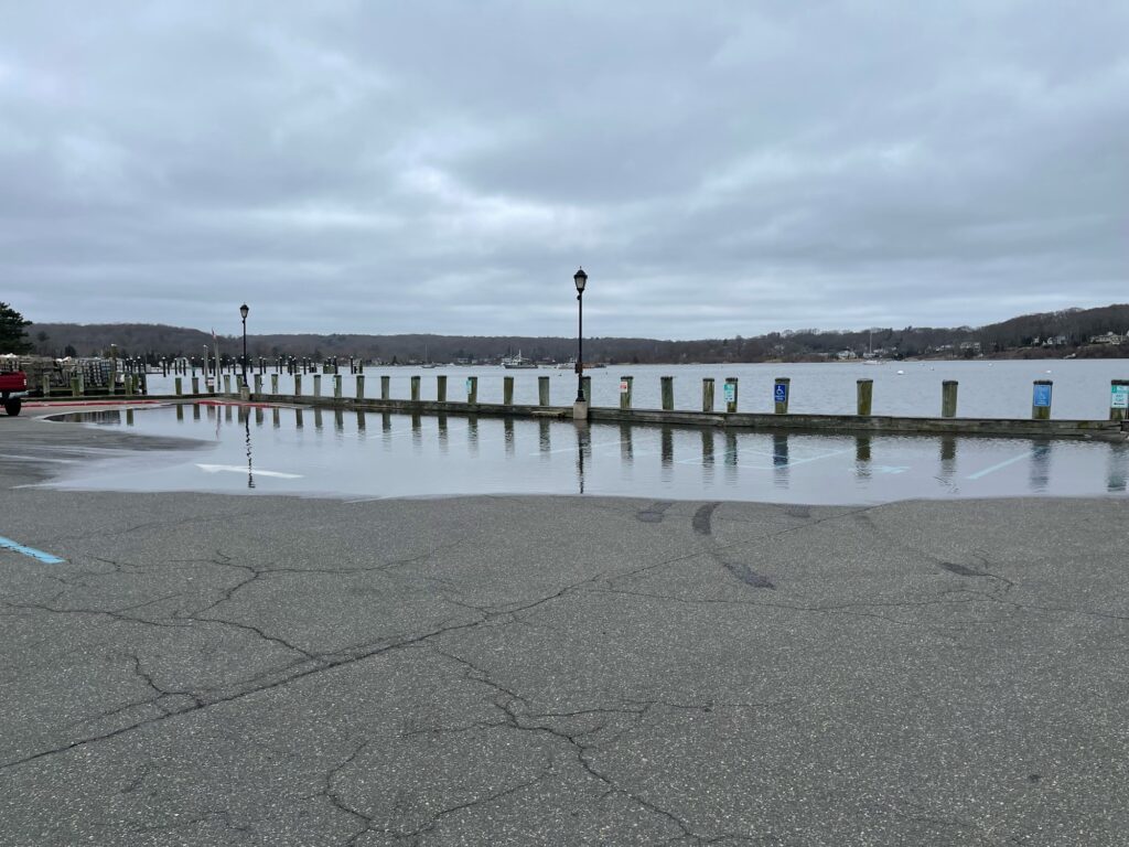 a body of water with a dock and a light post (MyCoast AI)