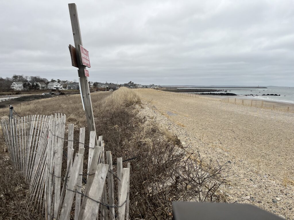 a wooden fence on a beach (MyCoast AI)