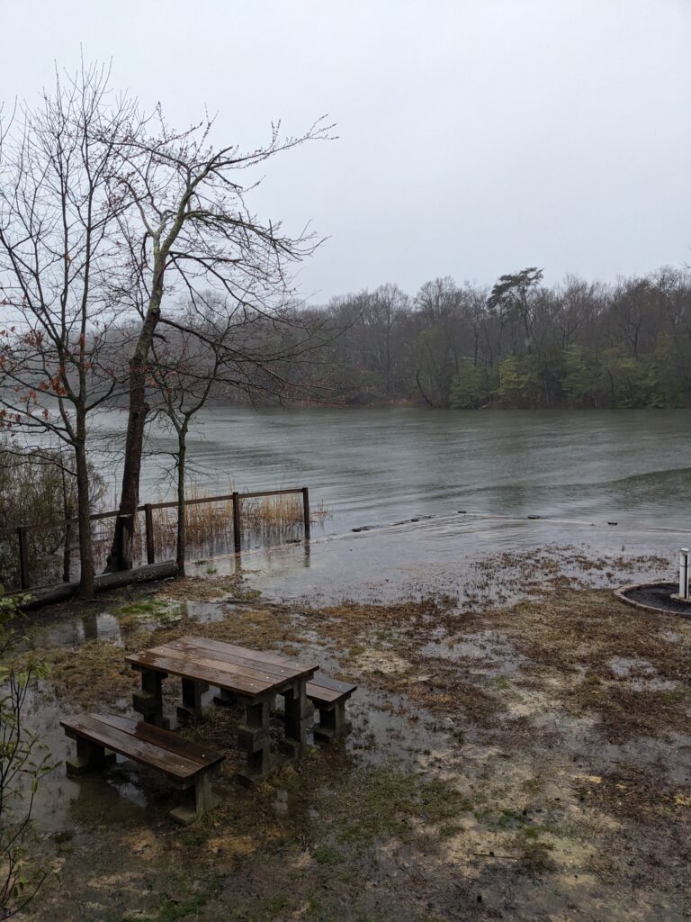 a picnic table next to a lake (MyCoast AI)