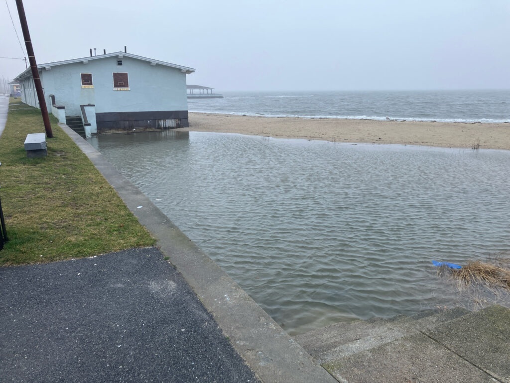a building next to a body of water (MyCoast AI)