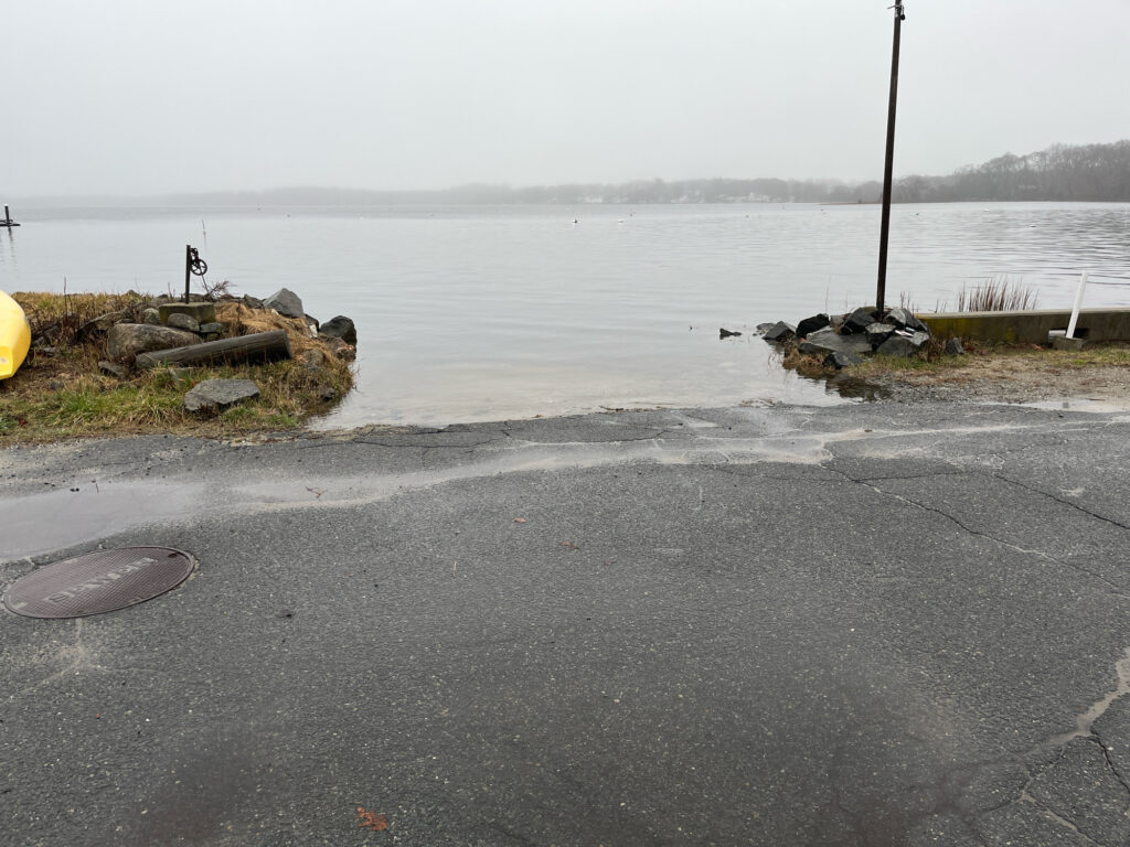 a road next to a body of water (MyCoast AI)