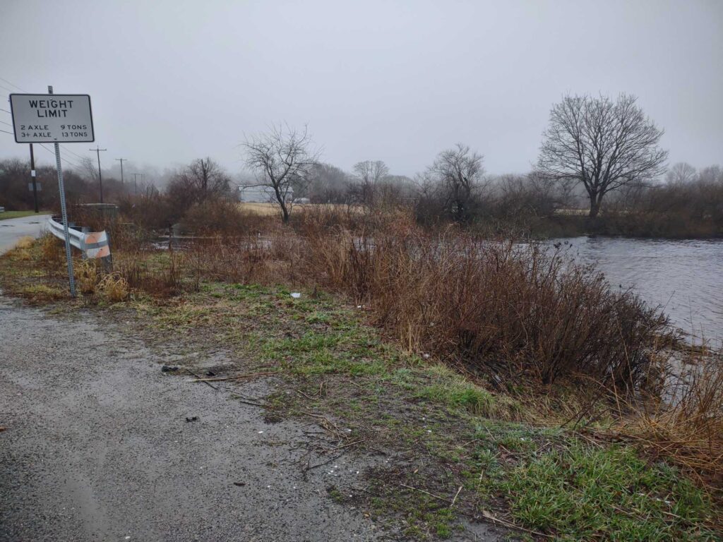 a river with a sign on the side (MyCoast AI)