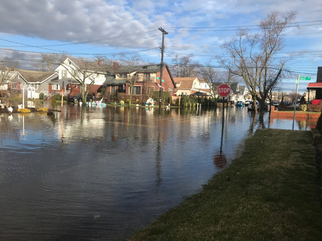 a flooded street with houses (MyCoast AI)