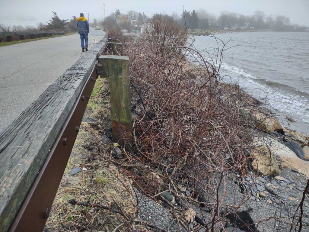a man walking on a path next to a body of water (MyCoast AI)