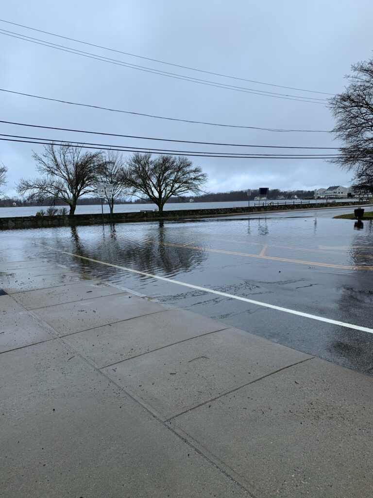 a puddle on a road (MyCoast AI)