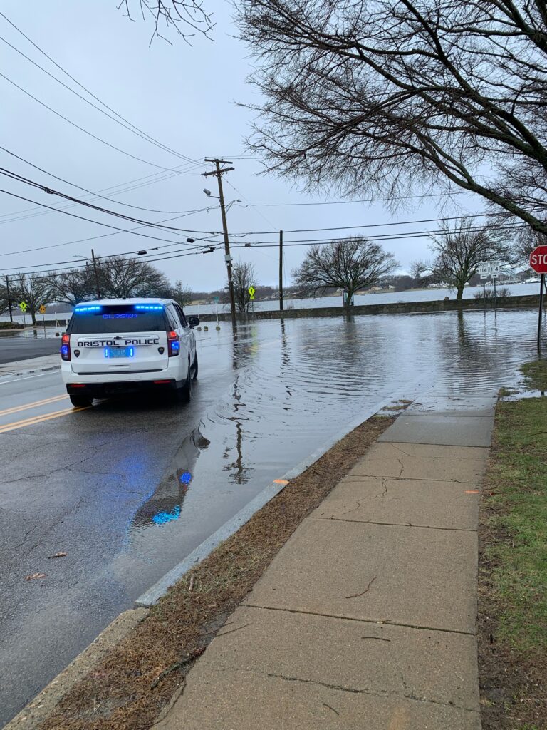 a truck driving through a flooded street (MyCoast AI)