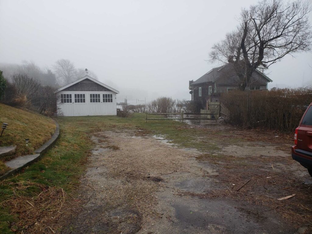 a dirt road with houses on either side of it (MyCoast AI)
