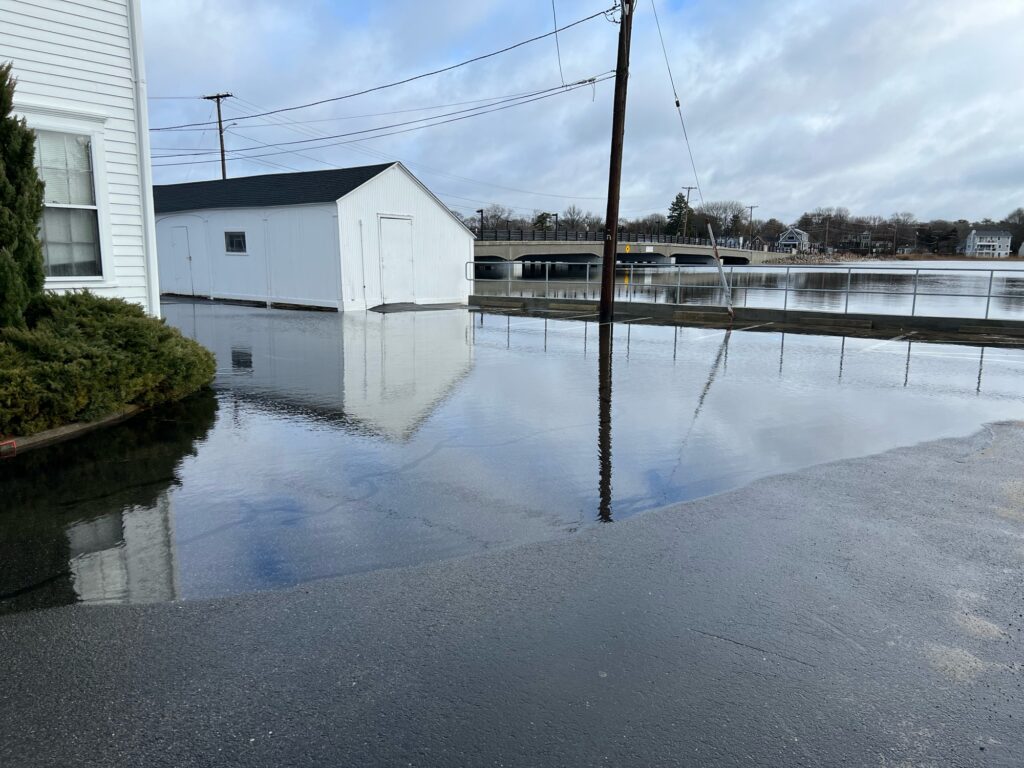 a flooded area with buildings and power lines (MyCoast AI)