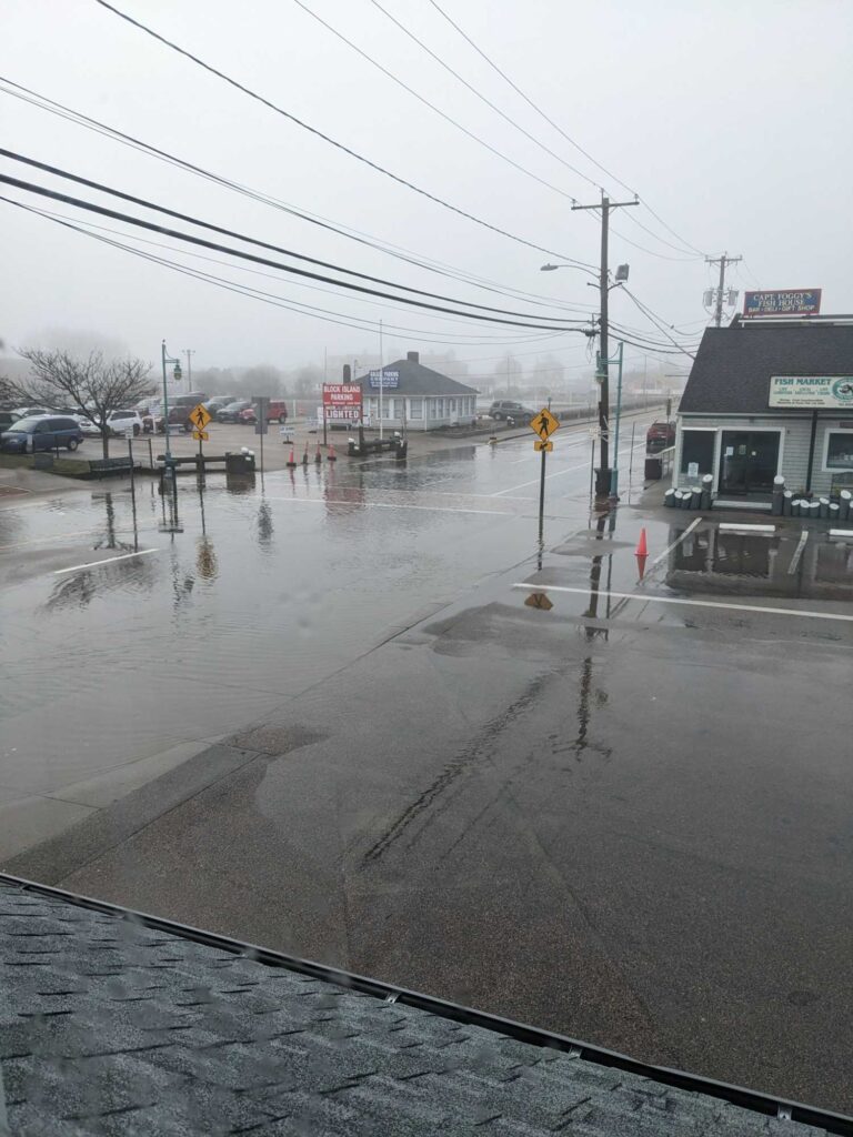 a flooded street with a few buildings (MyCoast AI)