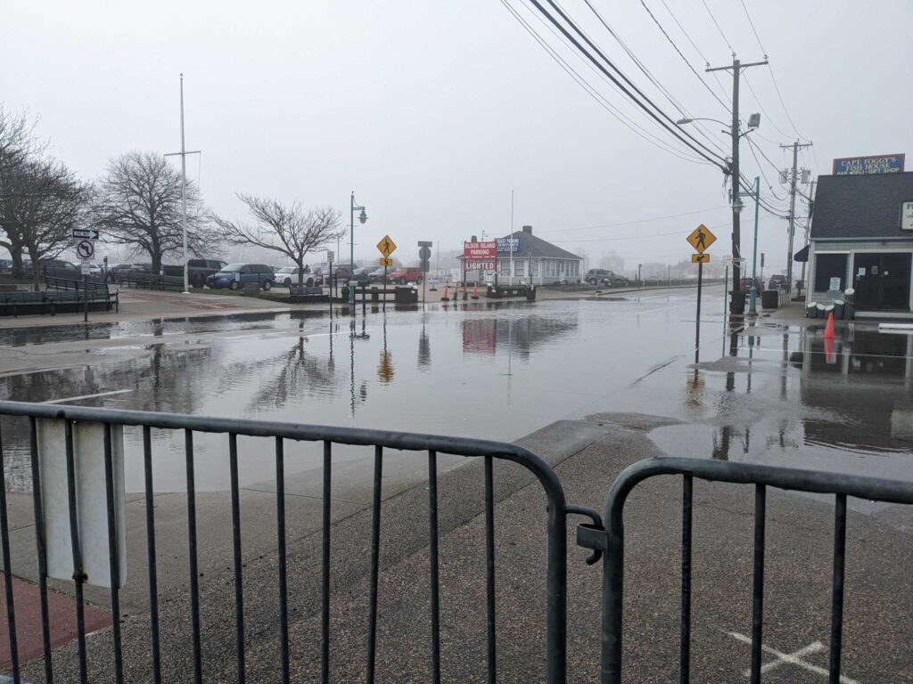 a flooded street with a fence (MyCoast AI)