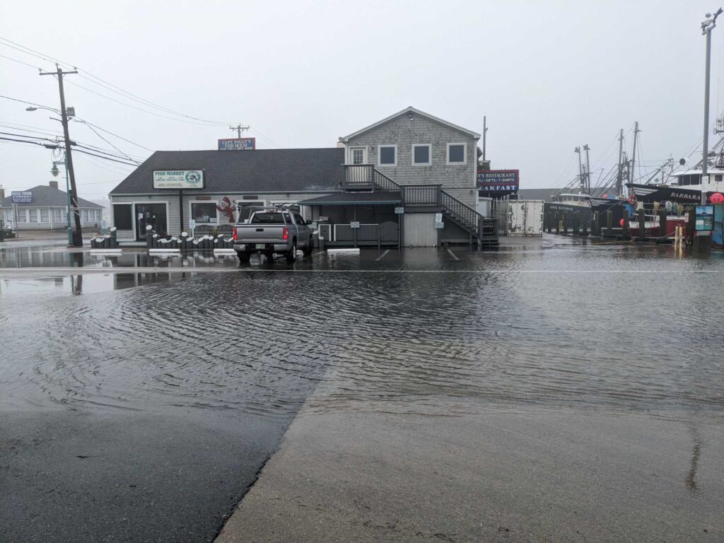 a flooded area with a truck parked in it (MyCoast AI)