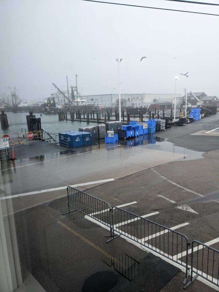 a parking lot with blue containers (MyCoast AI)