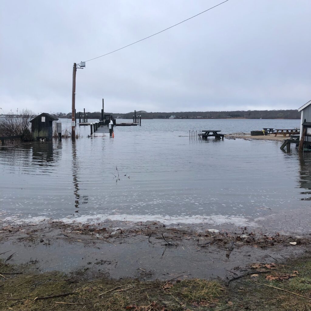 a body of water with a dock and a person on it (MyCoast AI)