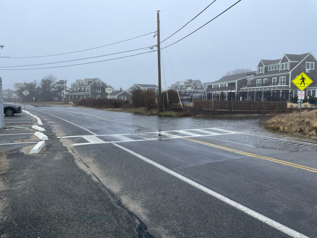a road with a yellow sign (MyCoast AI)