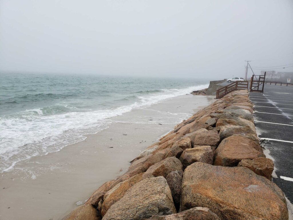 a beach with rocks and a pier (MyCoast AI)