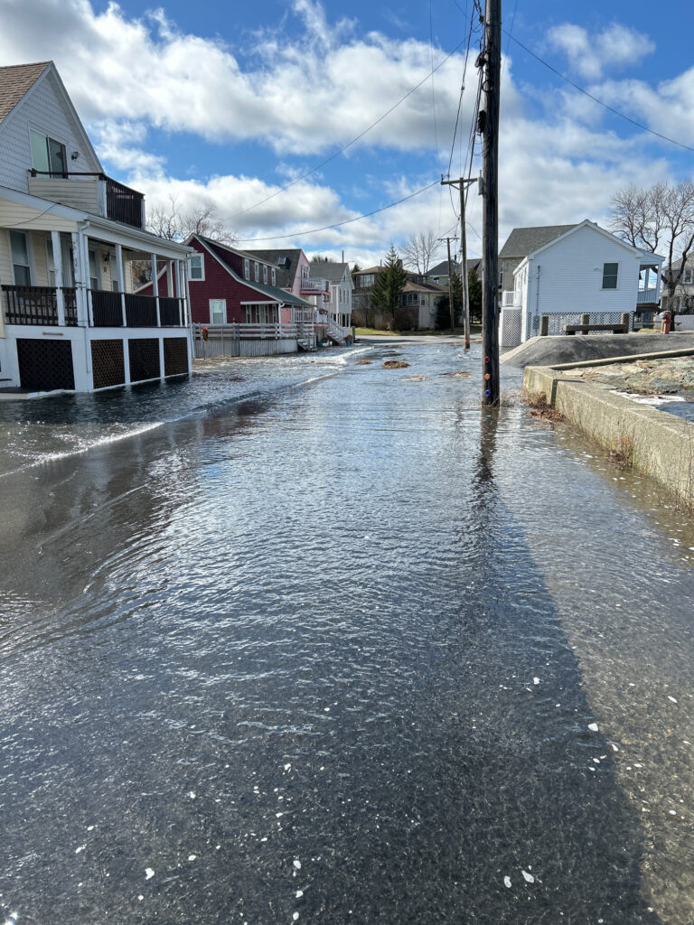 a flooded street with houses (MyCoast AI)