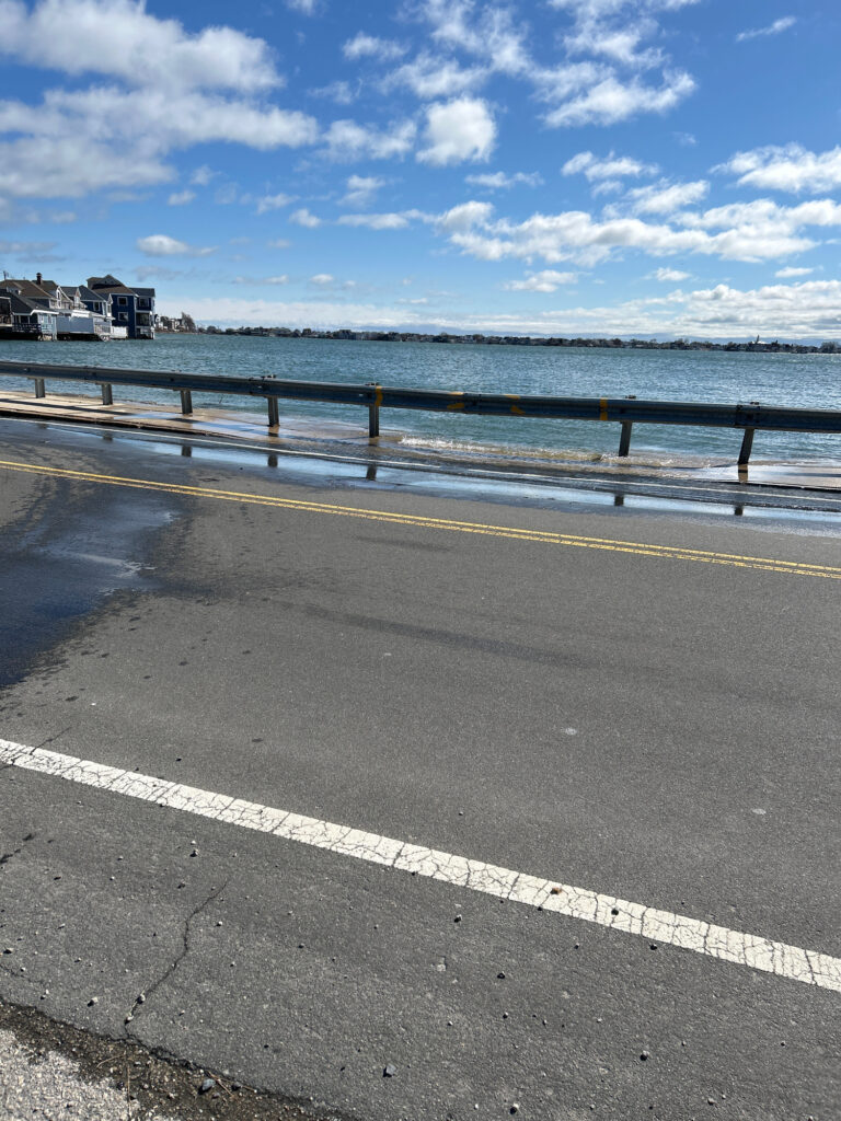 a road next to a body of water (MyCoast AI)