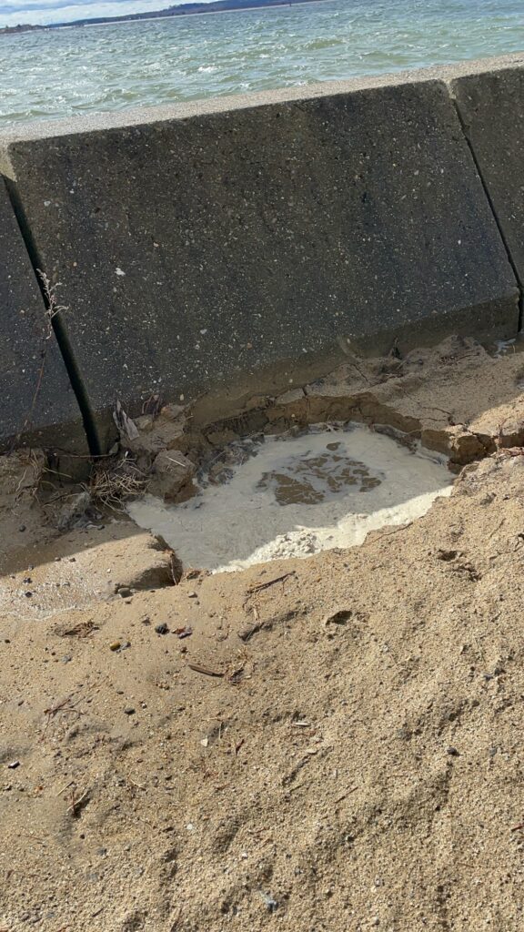 a hole in the ground with a hole in it and a hole in it with a hole in (MyCoast AI)