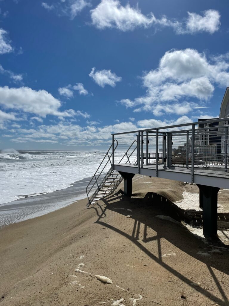 a wooden bridge over a beach (MyCoast AI)