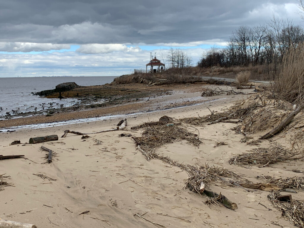 a sandy beach with a house on it (MyCoast AI)