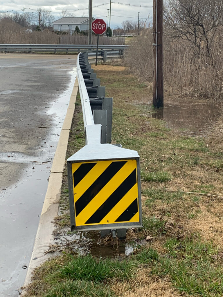 a sign on the side of a road (MyCoast AI)