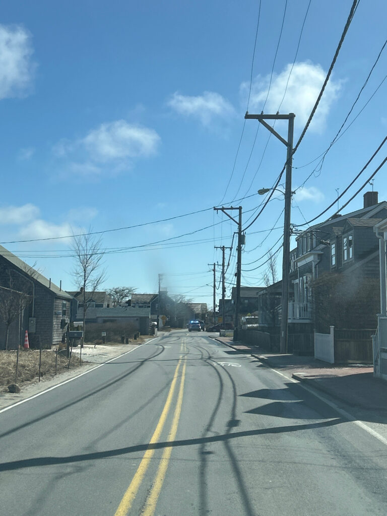 a road with power lines on the side (MyCoast AI)