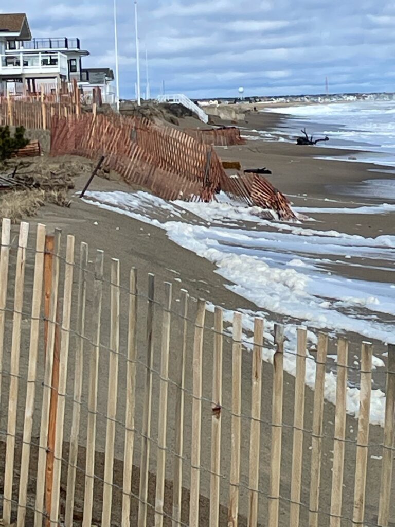 a wooden fence on a beach (MyCoast AI)