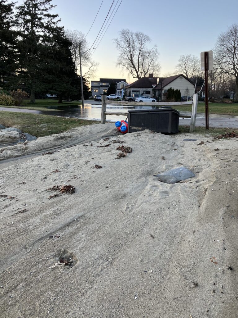 a driveway with a blue bucket and a blue bucket on it (MyCoast AI)