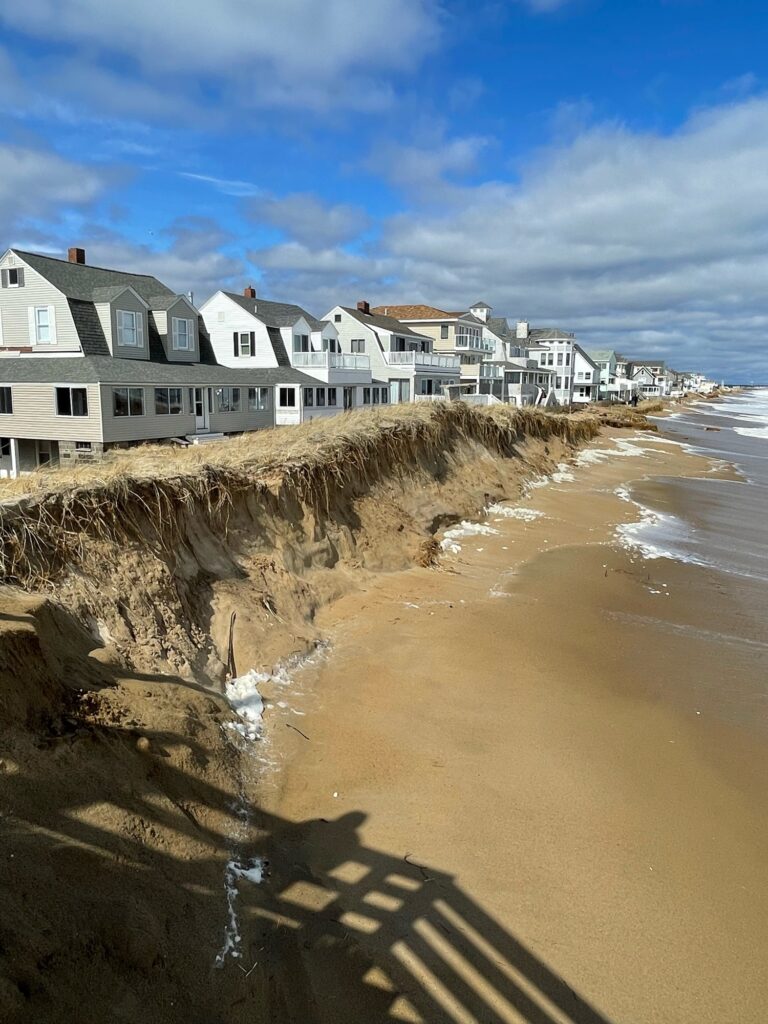 a beach with houses along it (MyCoast AI)