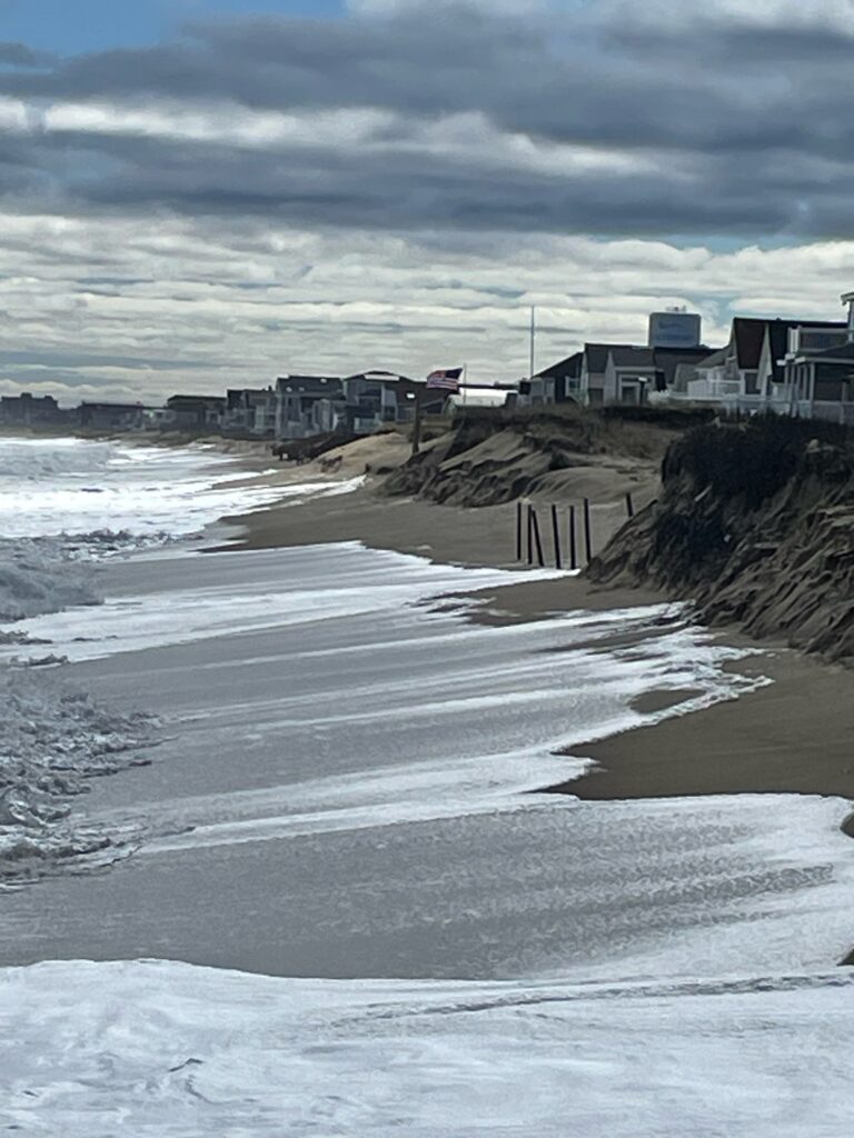 a beach with waves crashing on it (MyCoast AI)