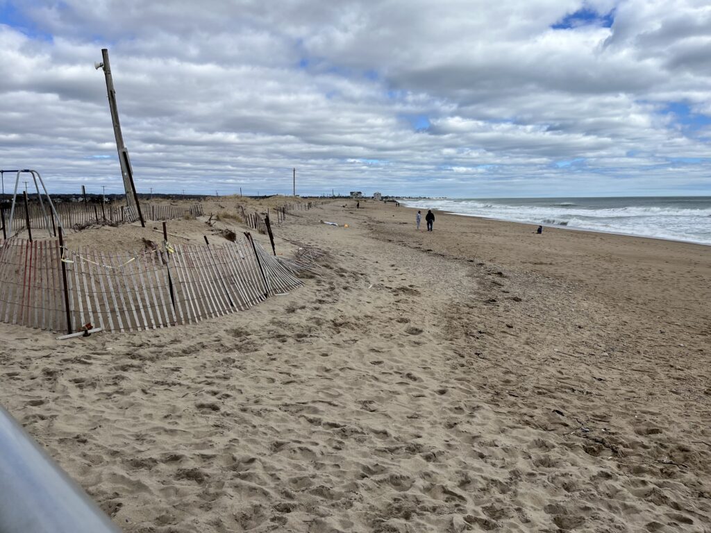 a beach with a fence and a wire fence (MyCoast AI)